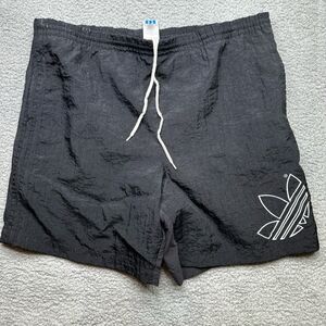 Vintage Adidas swim trunks lined. Size large